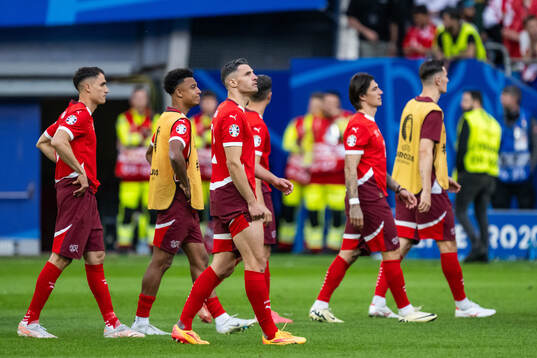 Fabian Schär of Switzerland looks dejected
