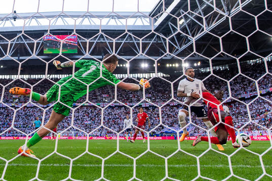Goalkeeper Jordan Pickford and Kyle Walker see Breel Embolo