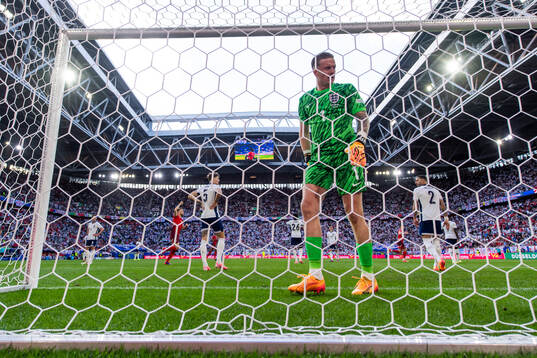 Goalkeeper Jordan Pickford of England looks dejected