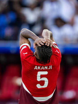 Manuel Akanji of Switzerland looks dejected