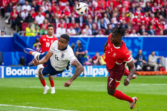 Ezri Konsa of England and Breel Embolo of Switzerland