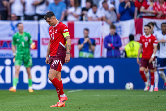 Granit Xhaka of Switzerland looks dejected
