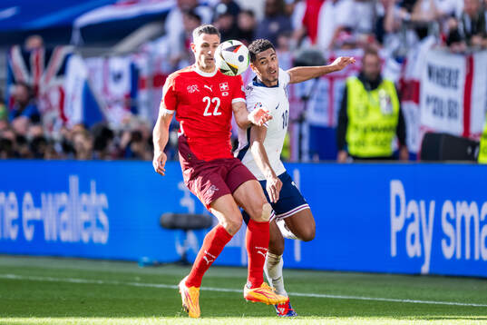 Fabian Schär of Switzerland and Jude Bellingham of England