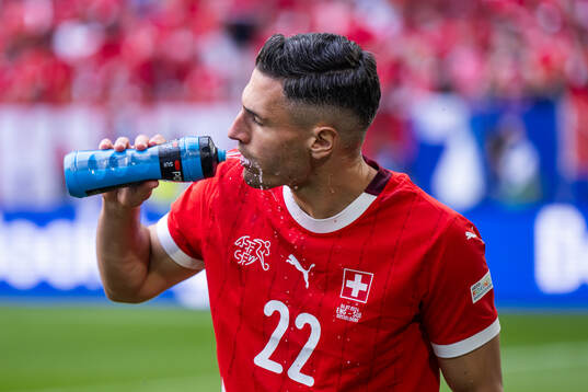 Fabian Schär of Switzerland drinks water