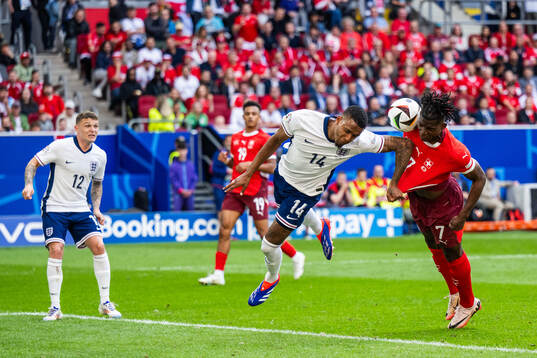 Ezri Konsa of England and Breel Embolo of Switzerland
