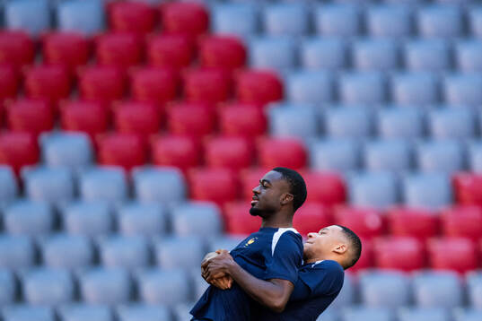 Youssouf Fofana and Kylian Mbappé at a training session