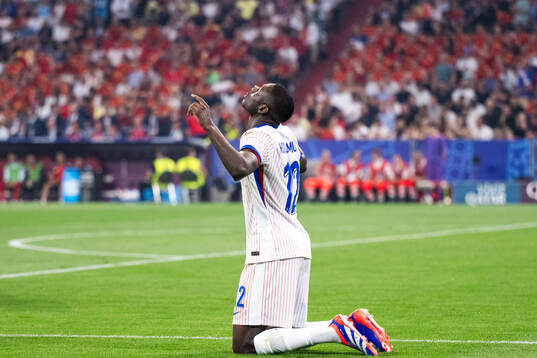 Randal Kolo Muani of France celebrates