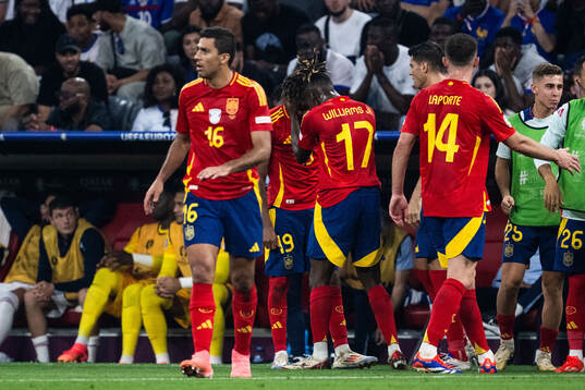 Lamine Yamal of Spain celebrates with Nicholas Williams