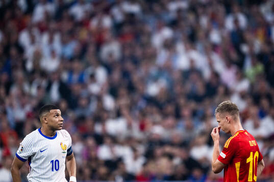 Kylian Mbappé of France and Daniel Olmo of Spain