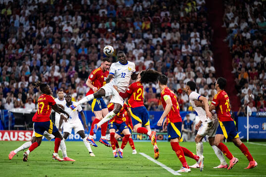 Randal Kolo Muani of France and Marc Cucurella of Spain