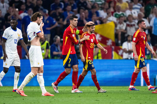 Alvaro Morata and Jesus Navas of Spain look dejected