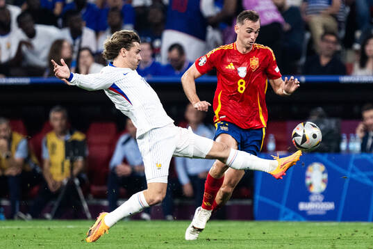 Antoine Griezmann of France and Fabian Ruiz Pena of Spain