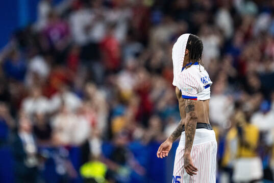Bradley Barcola of France looks dejected