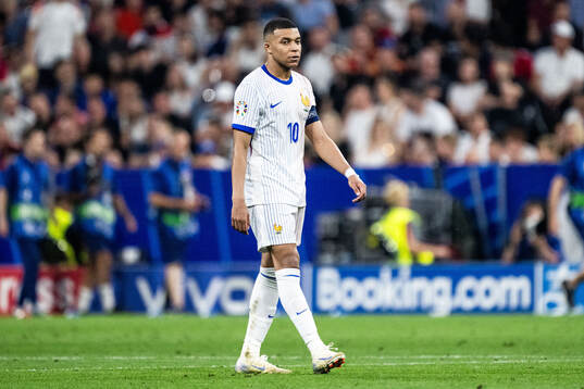 Kylian Mbappé of France looks dejected