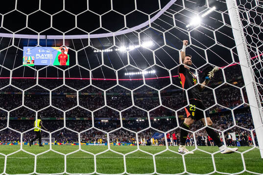 Goalkeeper Unai Simon Mendibil of Spain celebrates