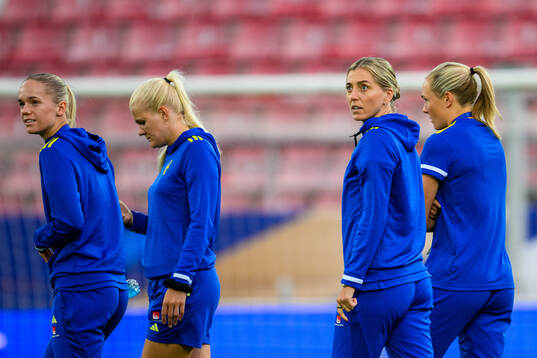 Hanna Lundkvist and Linda Sembrant of Sweden walks the pitch