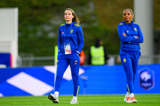 Kosovare Asllani and Madelen Janogy of Sweden walks the