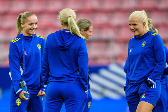 Hanna Lundkvist and goalkeeper Emma Holmgren of Sweden