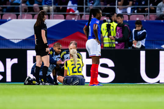 Josefine Rybrink of Sweden receives care