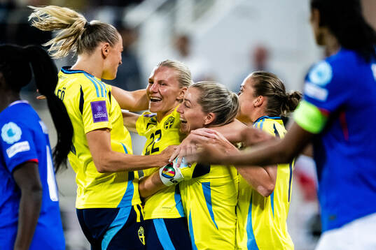 Josefine Rybrink of Sweden celebrates with teammates