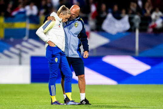 Fridolina Rolfö and assistant coach Magnus Wikman of Sweden