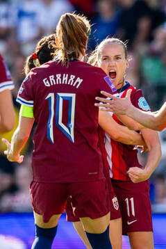Guro Reiten of Norway celebrates with Caroline Graham Hansen