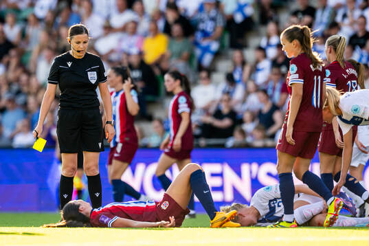 Referee Katalin Kulcsar gives Ingrid Syrstad Engen of