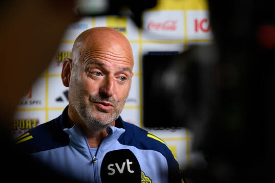 Assistant coach Magnus Wikman is being interviewed