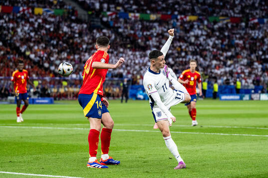 Aymeric Laporte of Spain and Phil Foden of England