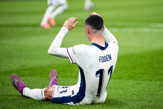 Phil Foden of England looks dejected