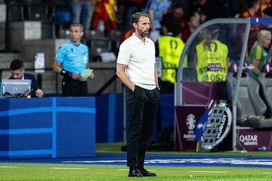 Head coach Gareth Southgate of England looks dejected