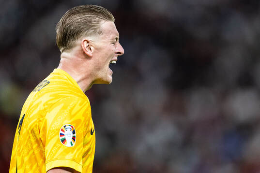 Goalkeeper Jordan Pickford of England reacts