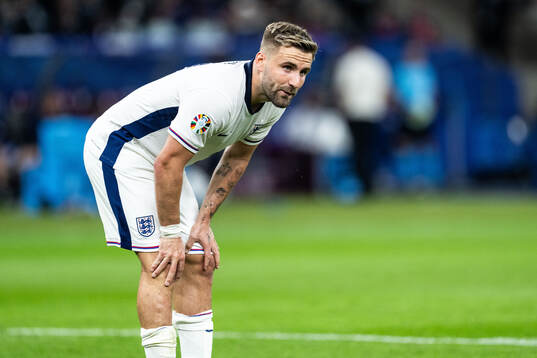 Luke Shaw of England looks dejected