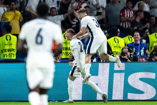 Cole Palmer and Luke Shaw of England celebrate