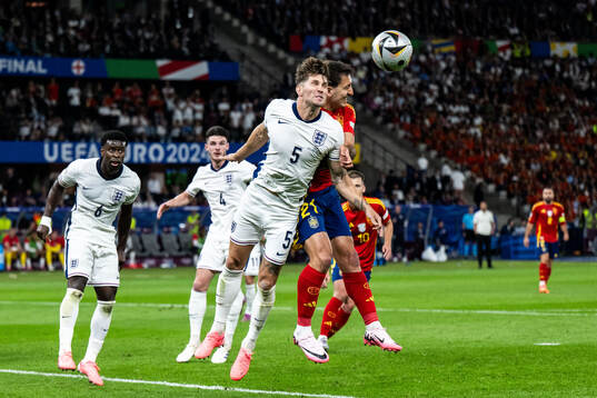 John Stones of England and Mikel Oyarzabal of Spain