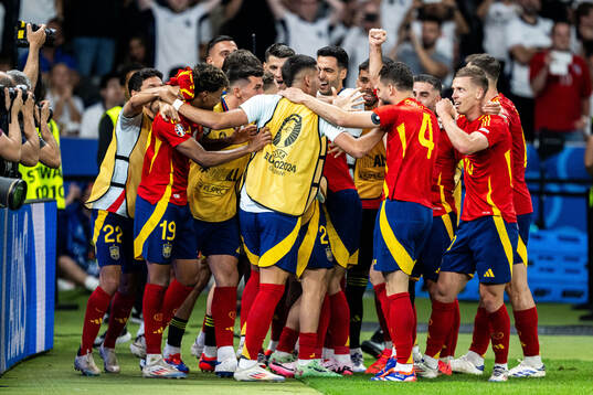Mikel Oyarzabal of Spain celebrates with team mates