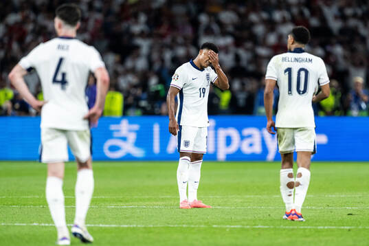 Ollie Watkins of England looks dejected