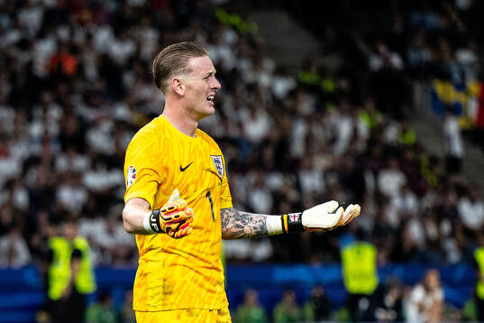 Goalkeeper Jordan Pickford of England looks dejected