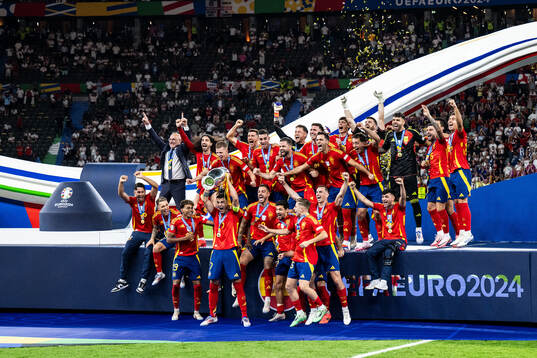 Alvaro Morata of Spain celebrates with team mates and the