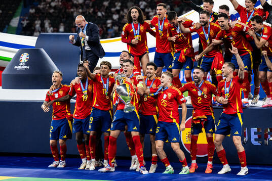 Alvaro Morata of Spain celebrates with team mates and the