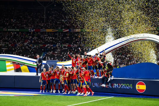 Alvaro Morata of Spain celebrates with team mates and the