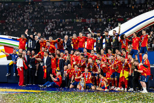 Players of Spain celebrate with the trophy