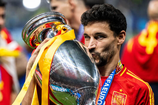 Jesus Navas of Spain celebrates with the trophy