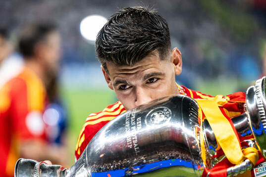 Alvaro Morata of Spain celebrates with the trophy