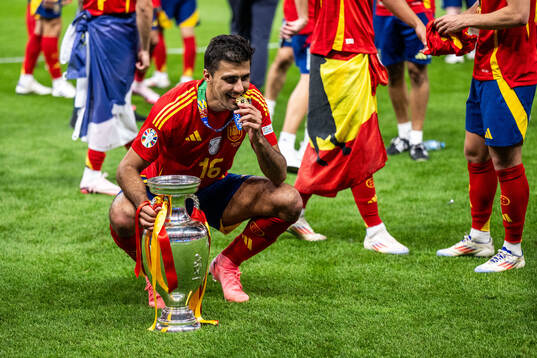 Rodrigo Hernandez of Spain celebrates with the trophy