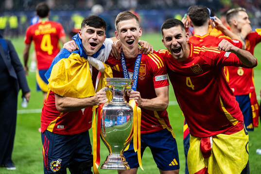Pedri and Daniel Olmo of Spain celebrates with the trophy