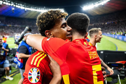 Lamine Yamal and Daniel Vivian of Spain celebrate