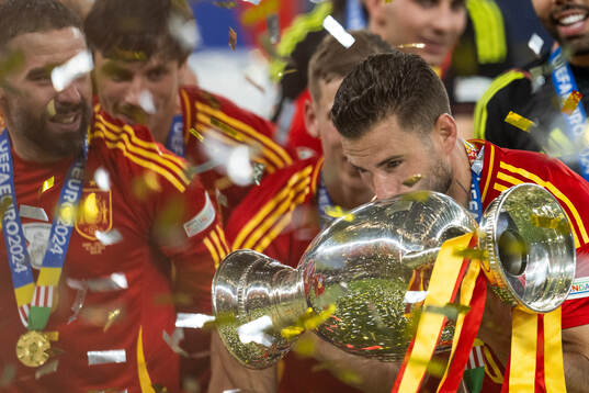 Nacho of Spain celebrates with the trophy