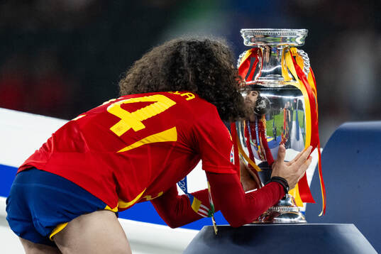 Marc Cucurella of Spain celebrates with the trophy
