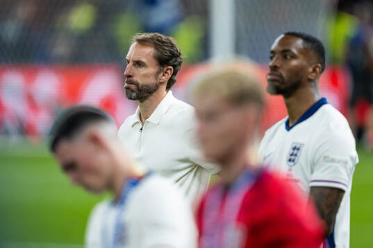 Head coach Gareth Southgate of England looks dejected